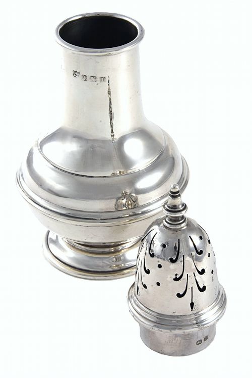 fig 2. A George V sterling silver sugar caster featuring a pierced dome lid with finial, baluster body, stepped base, and visible hallmarks.