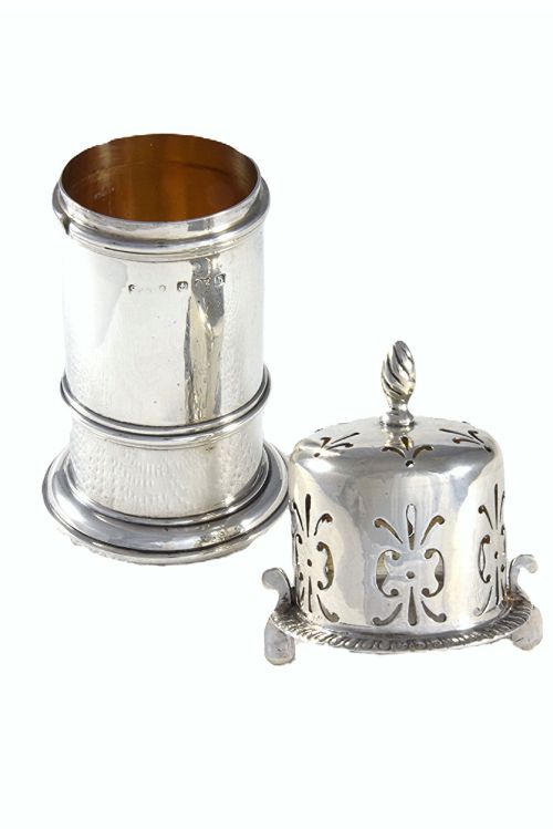 fig 2. A cylindrical Victorian sterling silver sugar caster featuring a pierced decorative cap topped with a spiral finial.