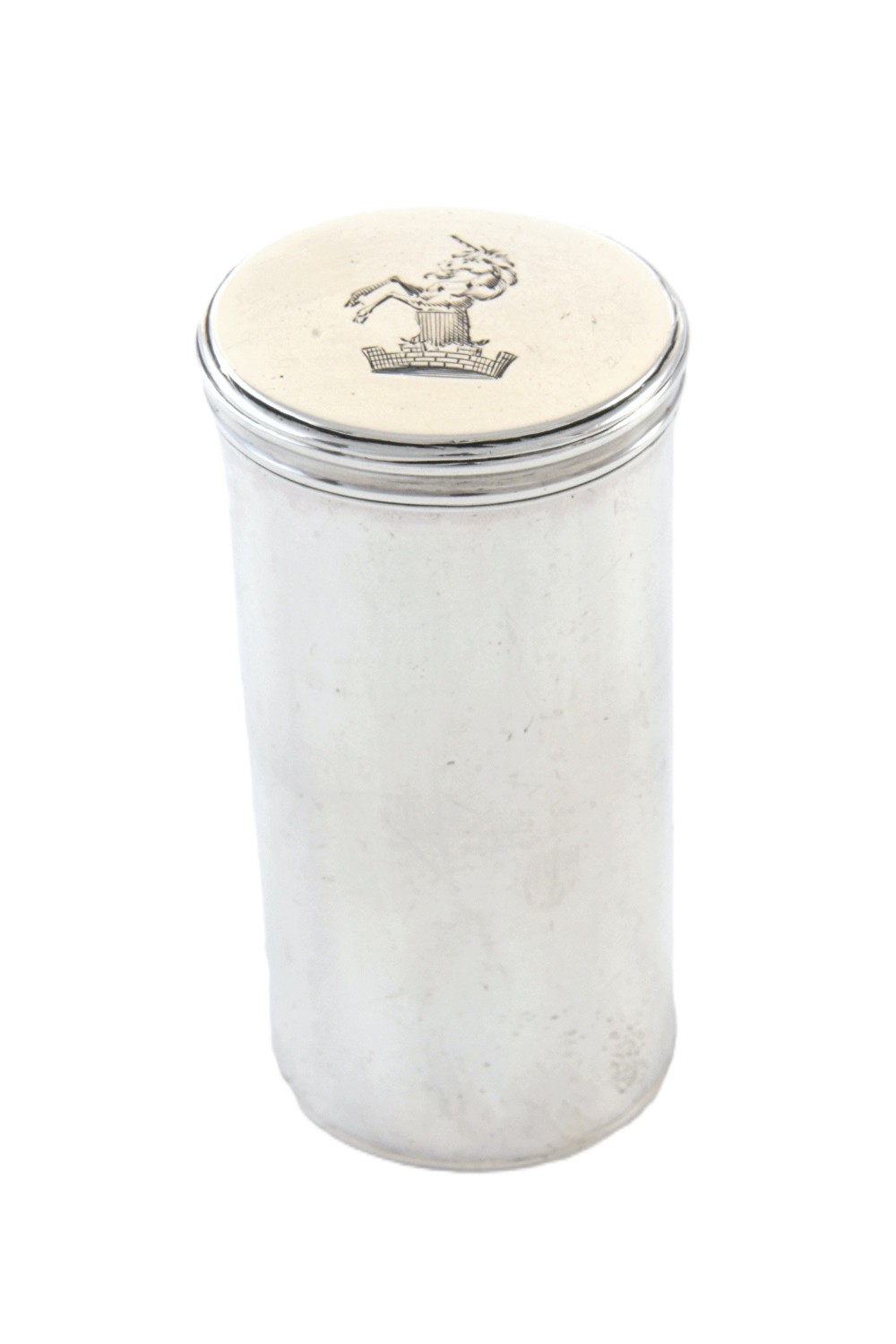 A cylindrical silver nutmeg grater from 1796 featuring an engraved heraldic crest of a unicorn on the lid.
