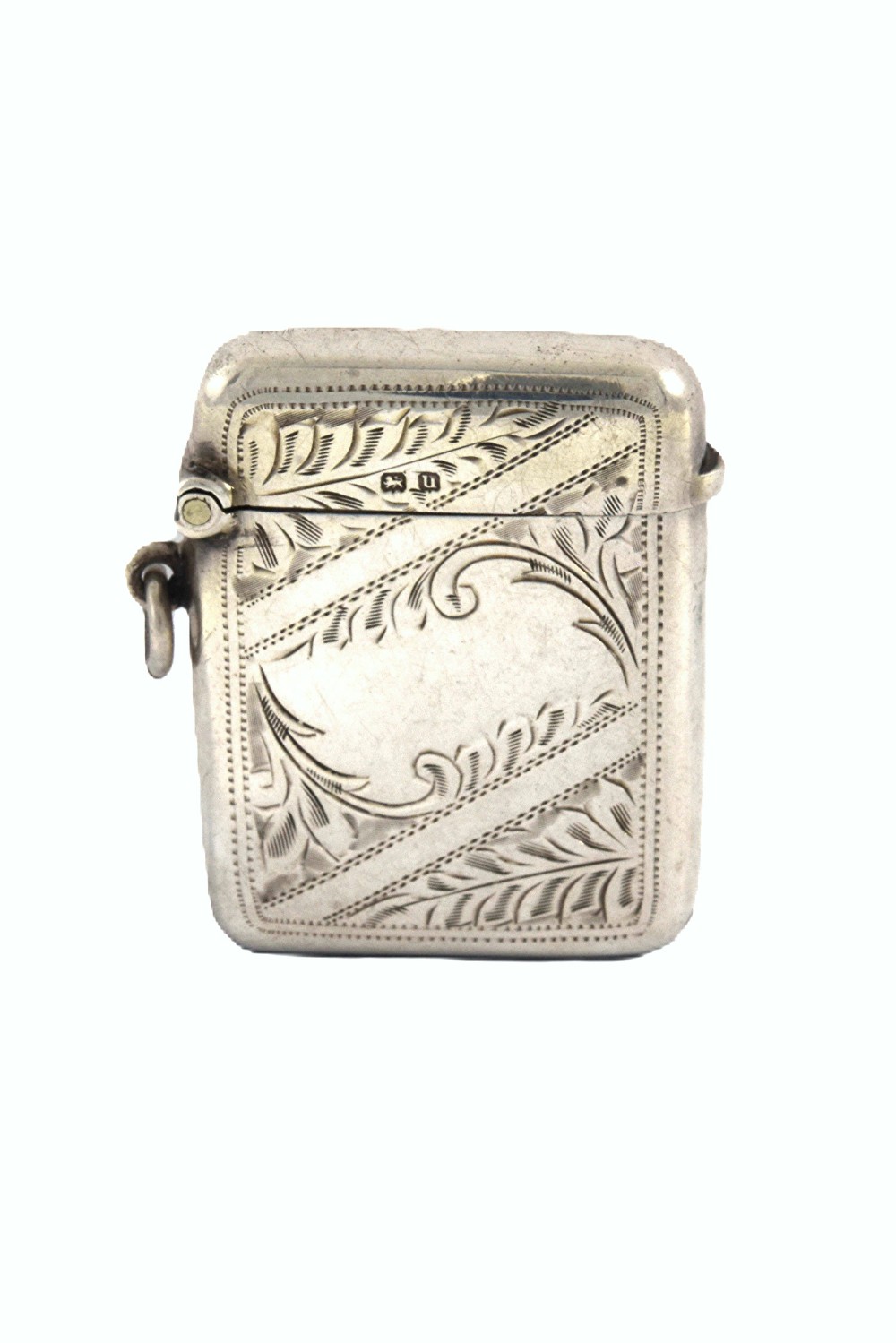 A small rectangular George V sterling silver vesta case decorated with hand-engraved foliage motifs, official hallmarks, and a side suspension ring.