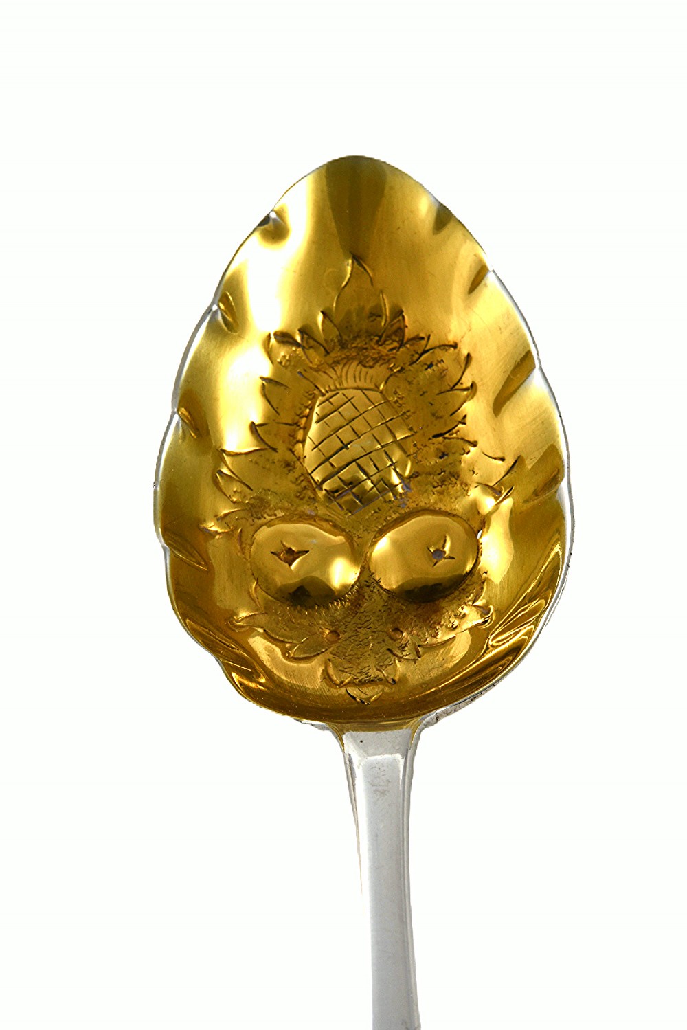 A pair of 1810 Georgian sterling silver berry spoons featuring engraved handles and gilded, repousse bowls embossed with fruit designs. View III