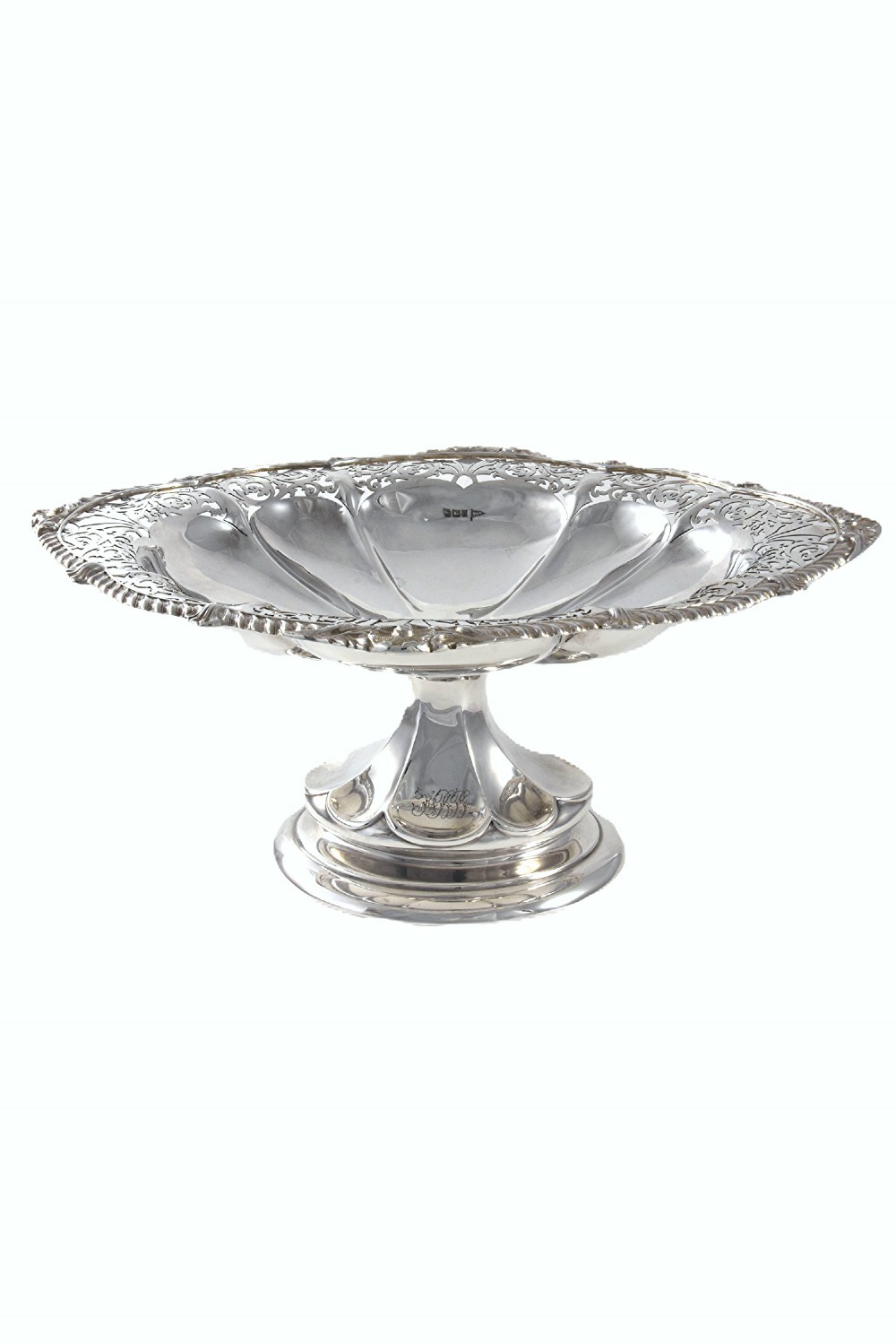 A solid sterling silver Edwardian pedestal dish with pierced decorative borders and a fluted lobed interior.