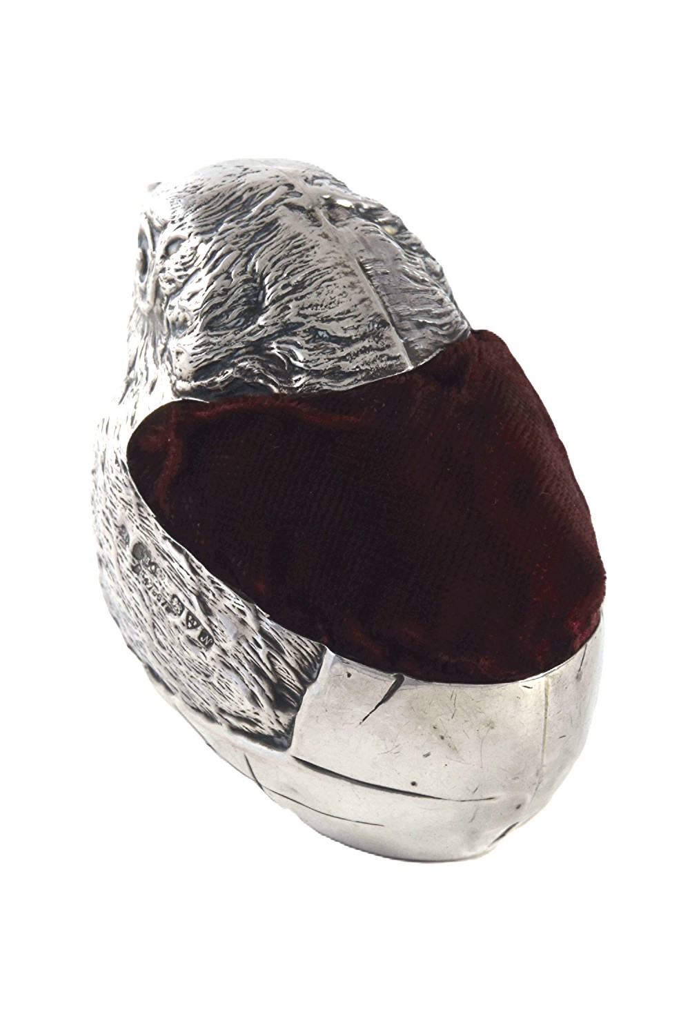 An antique sterling silver pin cushion modelled in the realistic form of a chick with detailed feather engraving and a deep burgundy velvet cushion insert. View IV