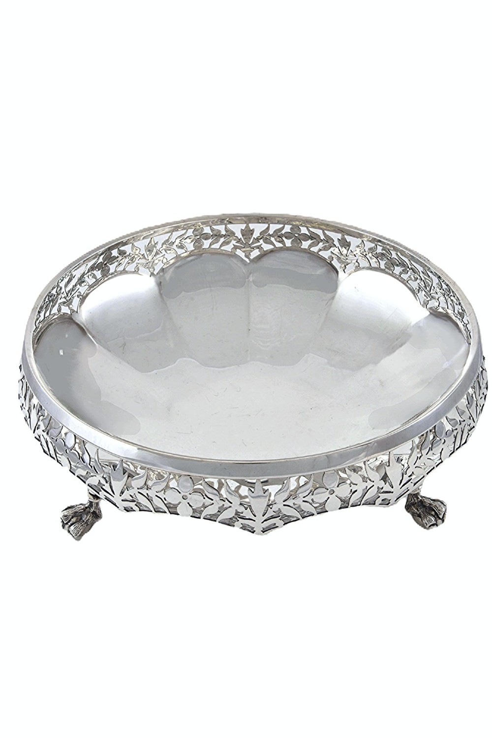 A shallow circular silver centrepiece bowl featuring intricate pierced fretwork around the border and supported by four cast claw feet.