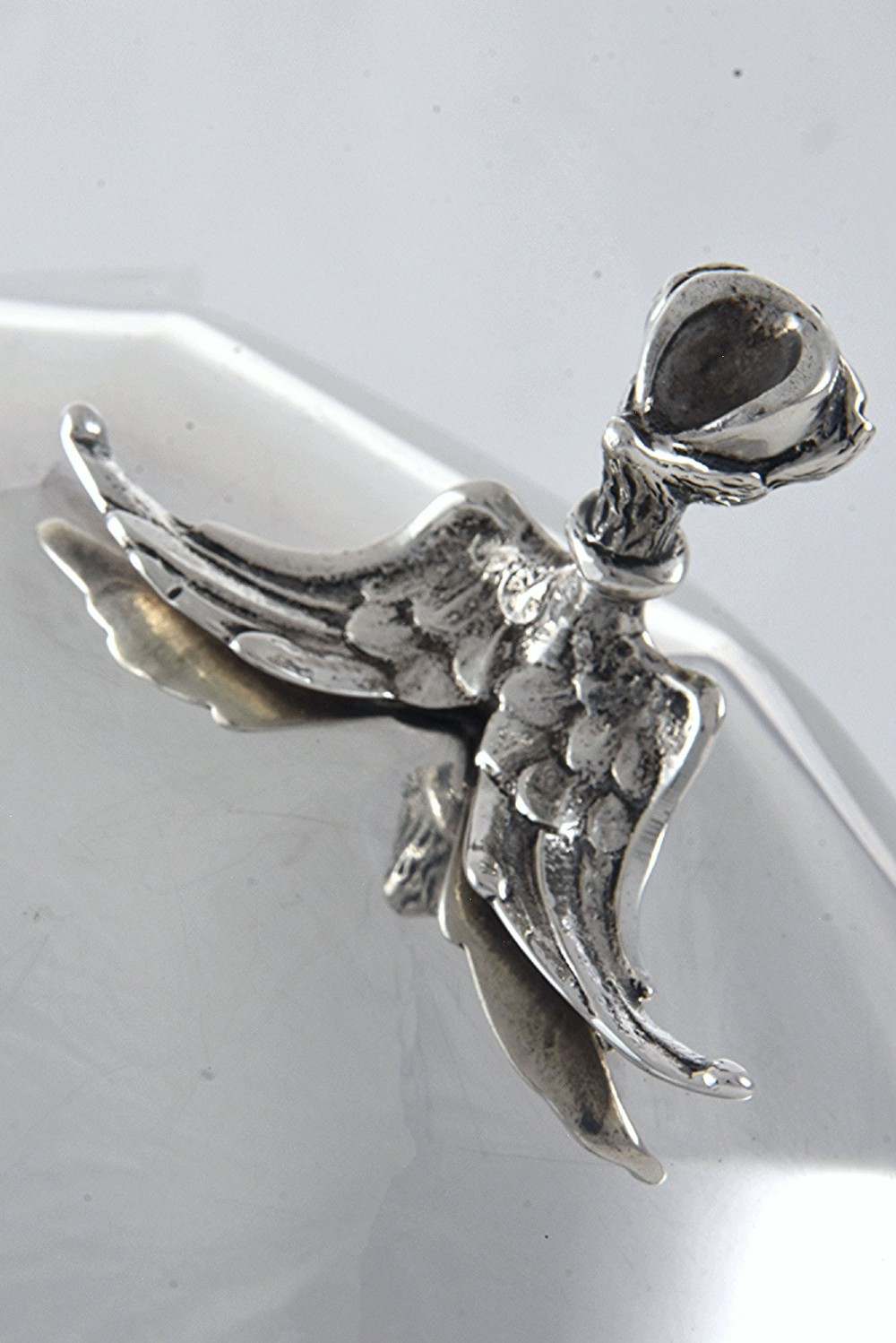 A shallow circular silver centrepiece bowl featuring intricate pierced fretwork around the border and supported by four cast claw feet. View IV