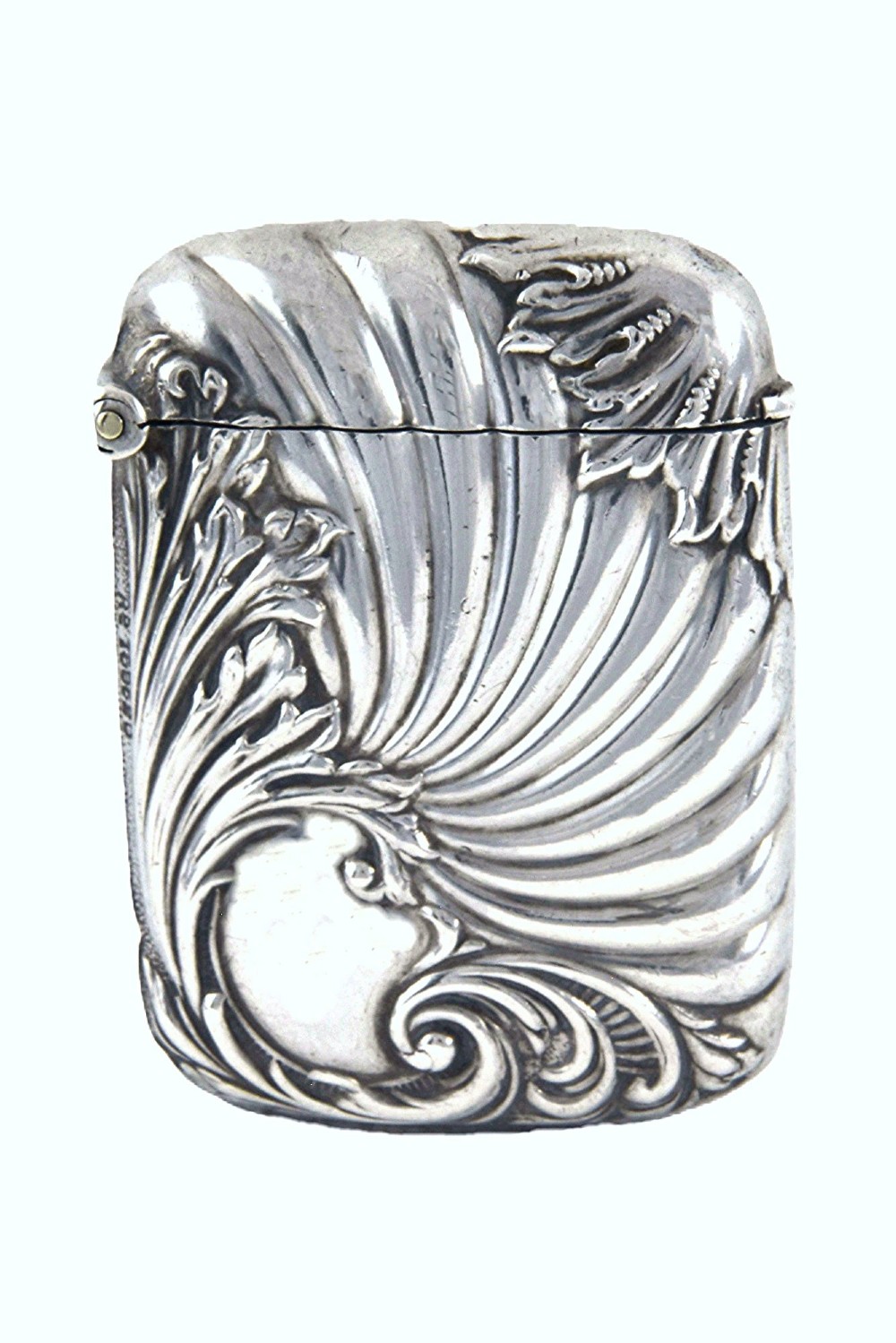 An Edwardian sterling silver vesta case decorated with embossed foliage and scrolling wave patterns.