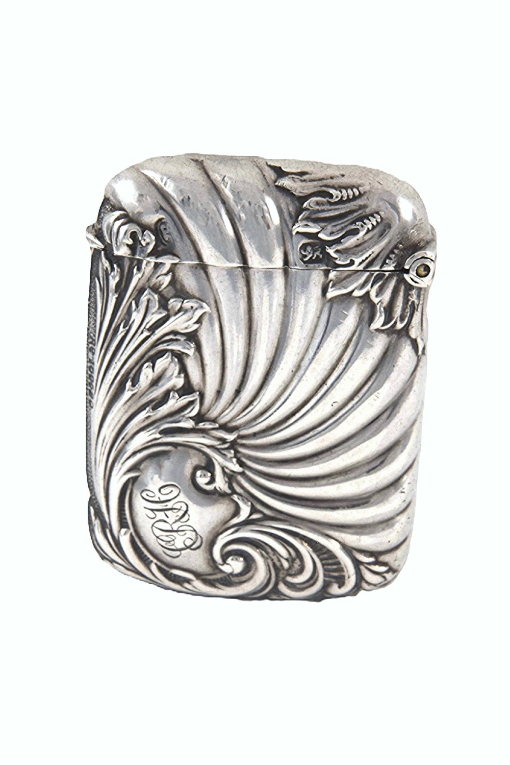 An Edwardian sterling silver vesta case decorated with embossed foliage and scrolling wave patterns. View II