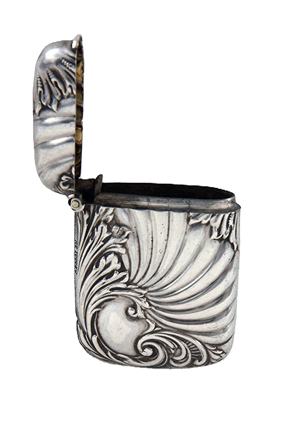 An Edwardian sterling silver vesta case decorated with embossed foliage and scrolling wave patterns. View III