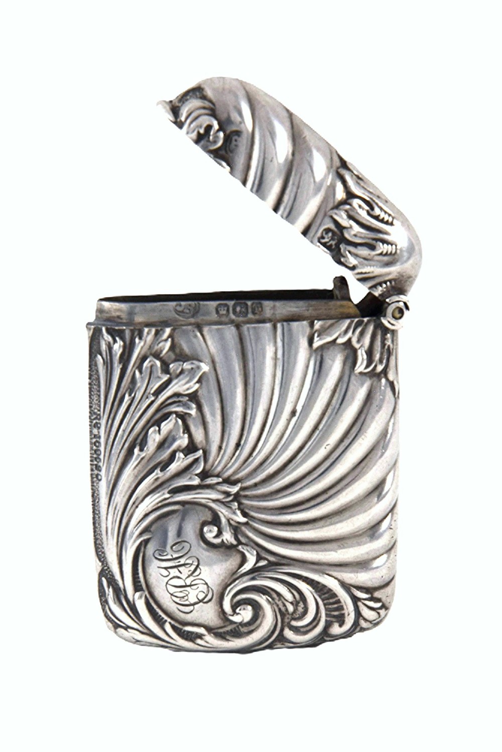 An Edwardian sterling silver vesta case decorated with embossed foliage and scrolling wave patterns. View IV