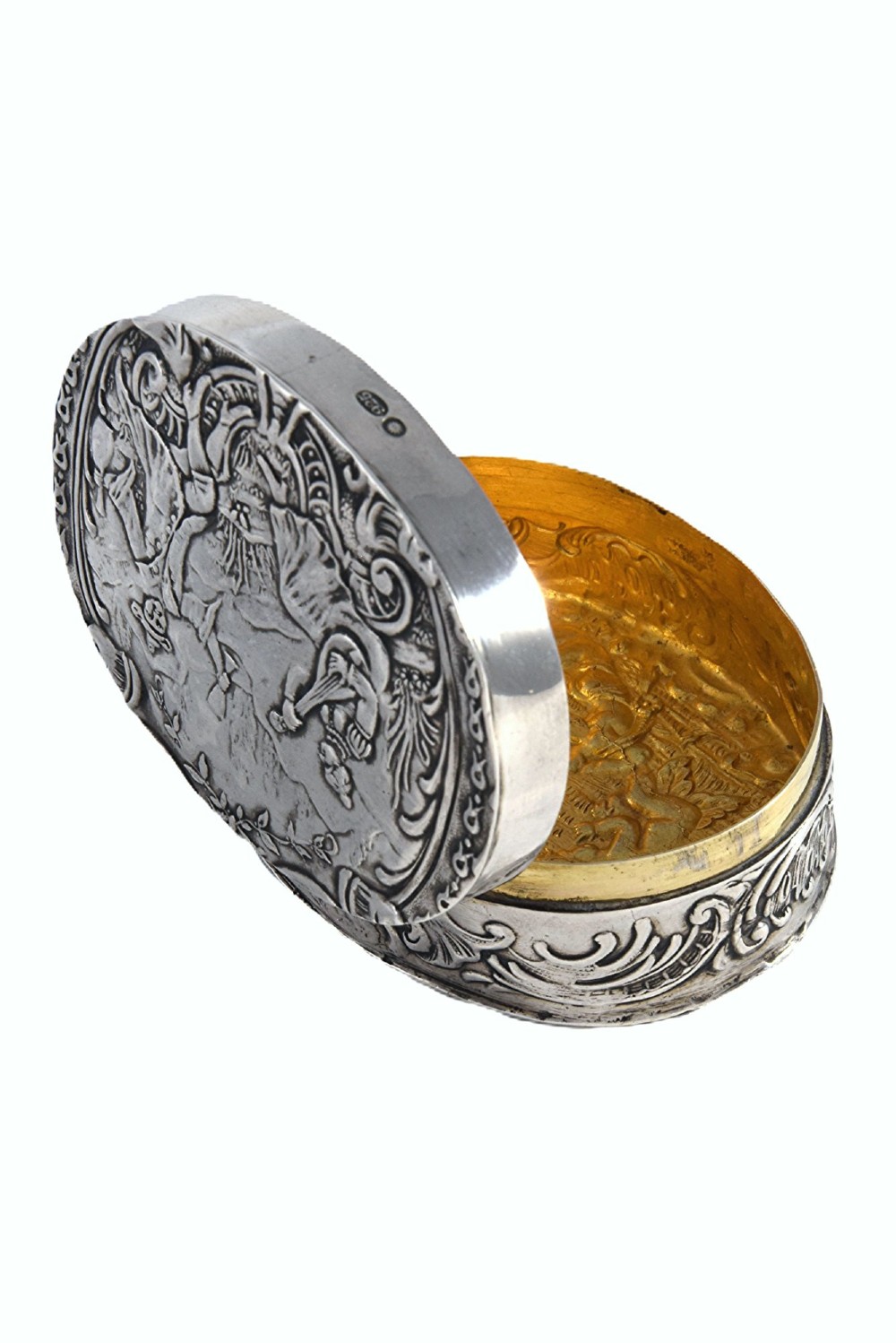 An oval sterling silver Edwardian snuff box with a relief scene on the hinged lid and floral scrollwork around the sides. View IV