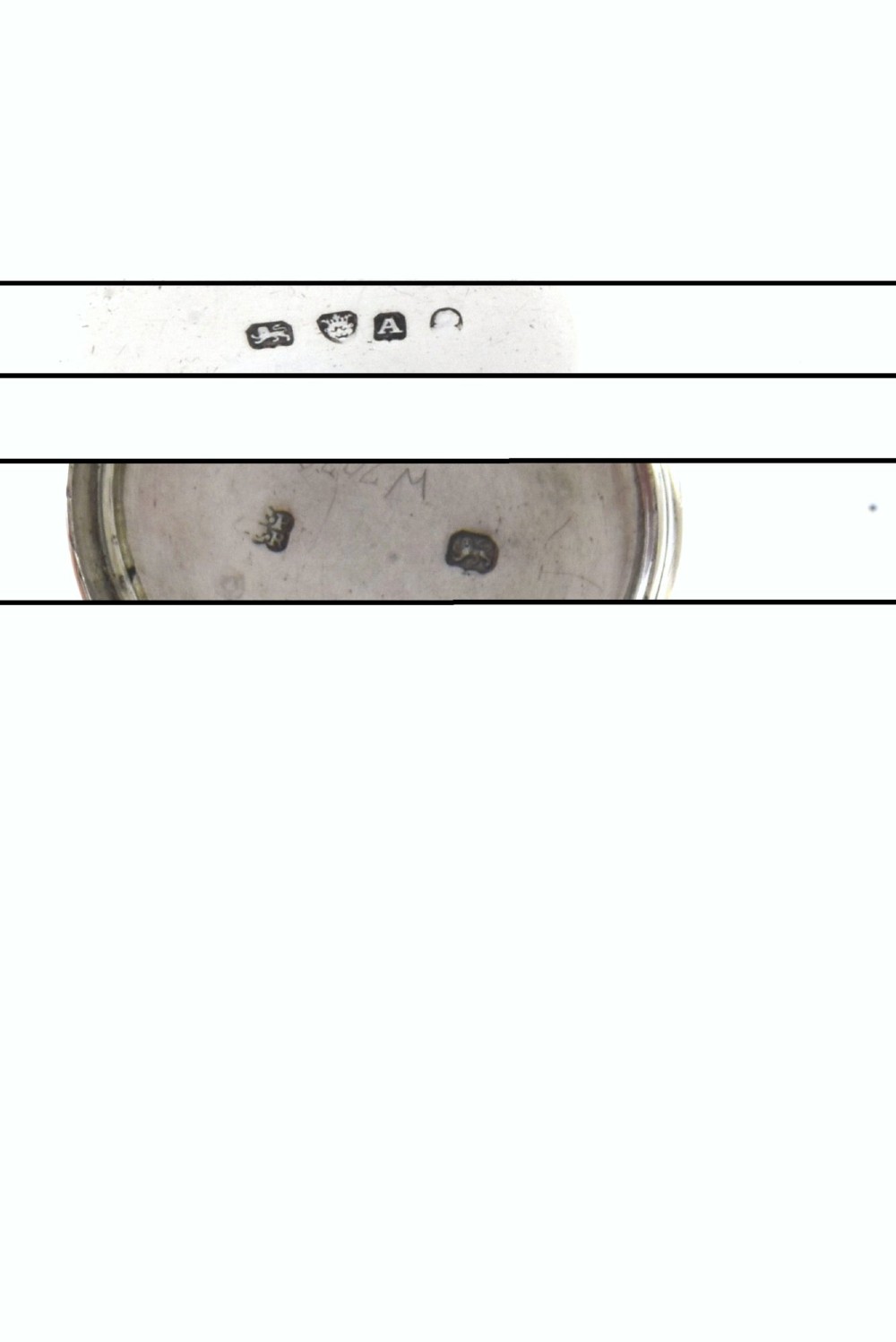 A cylindrical Georgian sterling silver nutmeg grater dated 1796 with an engraved crest on the flat top lid. View V