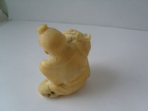 fig 2. Unusual Japanese Ivory Okimono Carving Of A Man Holding A Conch Shell