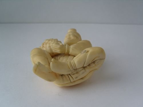 fig 3. Unusual Japanese Ivory Okimono Carving Of A Man Holding A Conch Shell