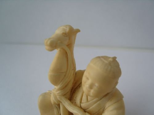fig 1. Stunning Japanese Ivory Okimono Carving Of A Man Making A Hobby Horse