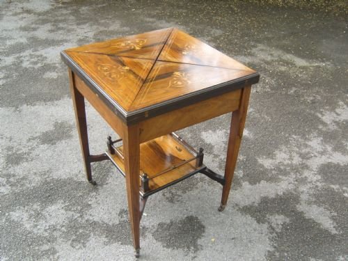 An Edwardian Inlaid Rosewood Envelope Card Table 

An Edwardian Inlaid Rosewood Envelope Card Table 

An Edwardian Inlaid Rosewood Envelope Card Table 

Edwardian Inlaid Rosewood Envelope Card Table