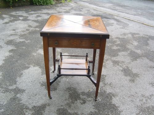 fig 1. An Edwardian inlaid rosewood envelope card table
An Edwardian inlaid rosewood envelope card table
An Edwardian inlaid rosewood envelope card table
Edwardian Inlaid Rosewood Envelope Card Table
