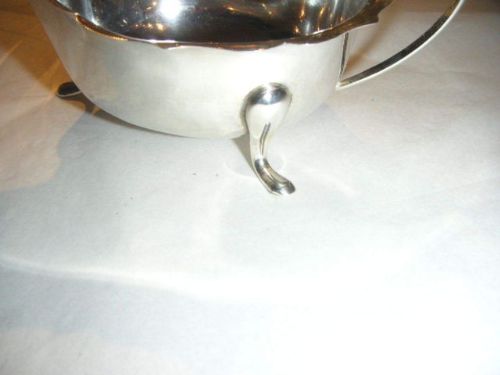 fig 2. SILVER SAUCE BOAT WITH SCALLOPED EDGE ON THREE FEET BY VINERS 1937