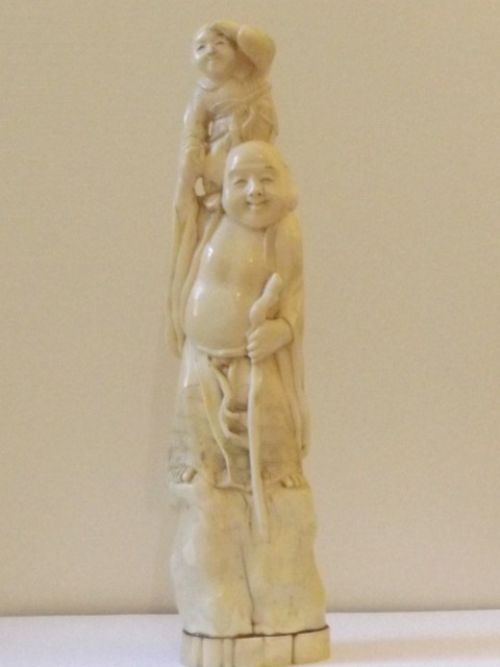 A Large Japanese Ivory Okimono of a Buddha Standing Holding a Child C1890 Meiji Period  28.5cm Height