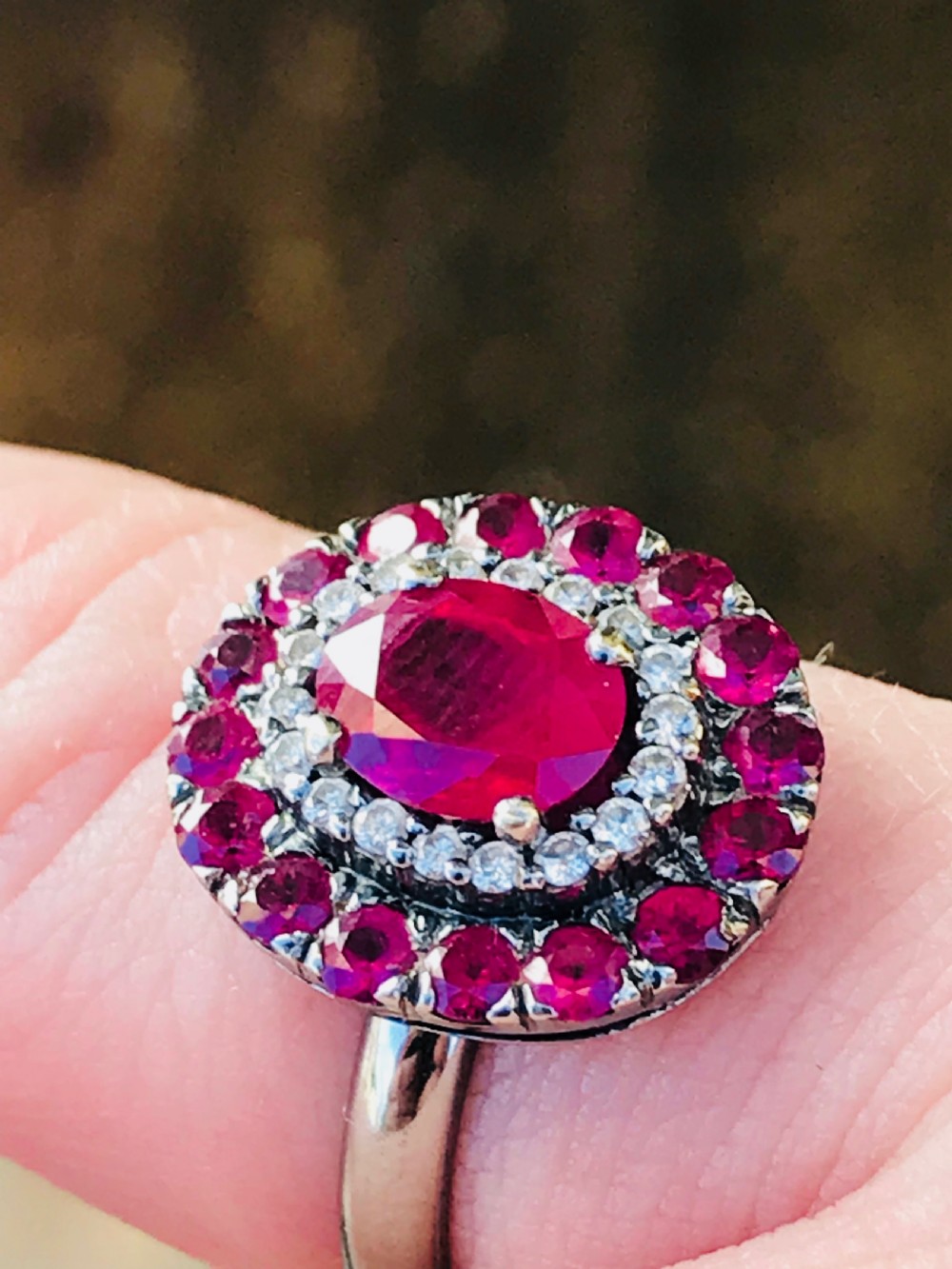A beautiful Art Deco 18ct white gold ruby and diamond cluster ring View III