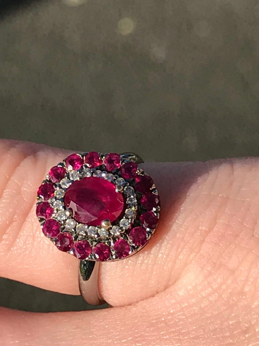 A beautiful Art Deco 18ct white gold ruby and diamond cluster ring View V