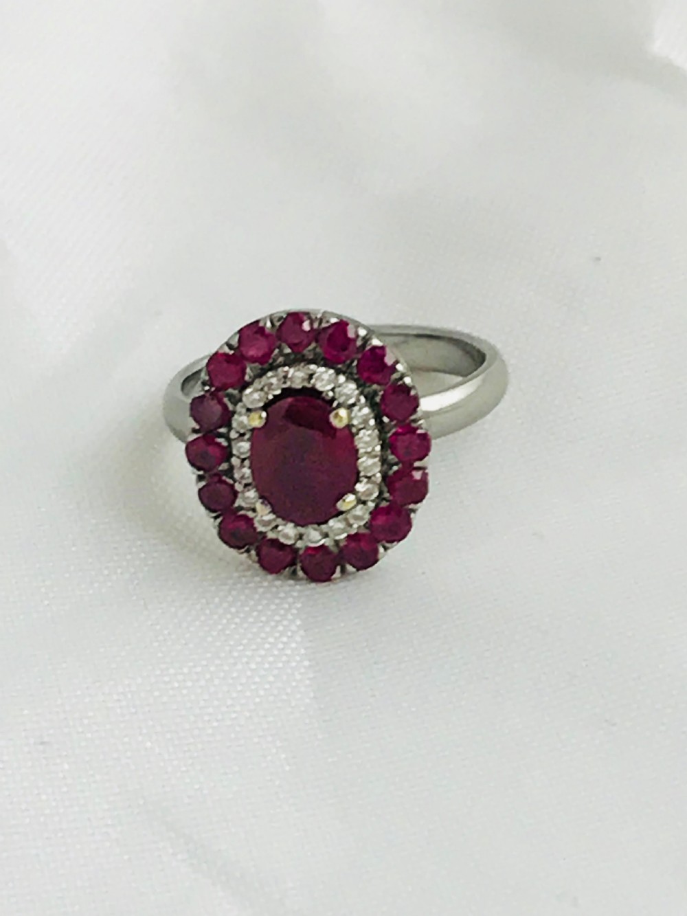 A beautiful Art Deco 18ct white gold ruby and diamond cluster ring View VII