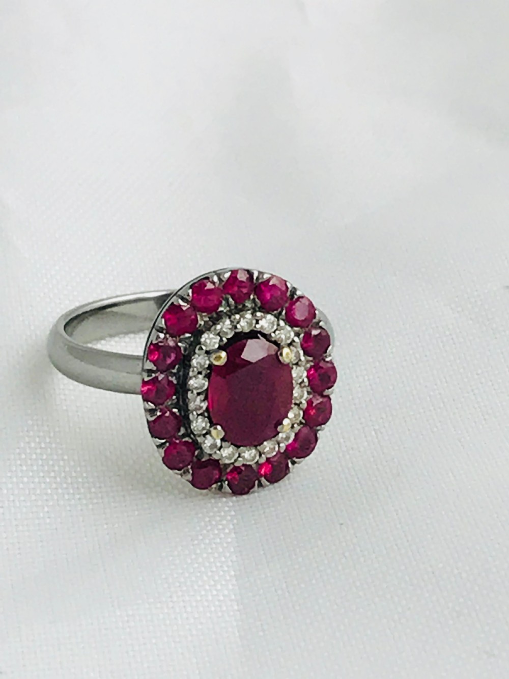 A beautiful Art Deco 18ct white gold ruby and diamond cluster ring View VIII