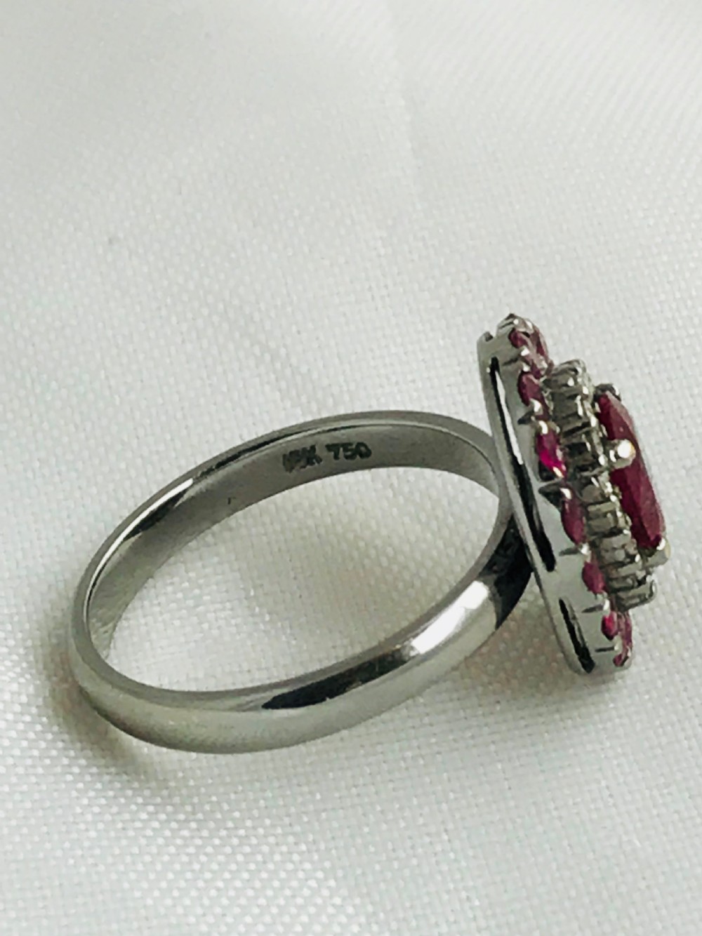 A beautiful Art Deco 18ct white gold ruby and diamond cluster ring View IX