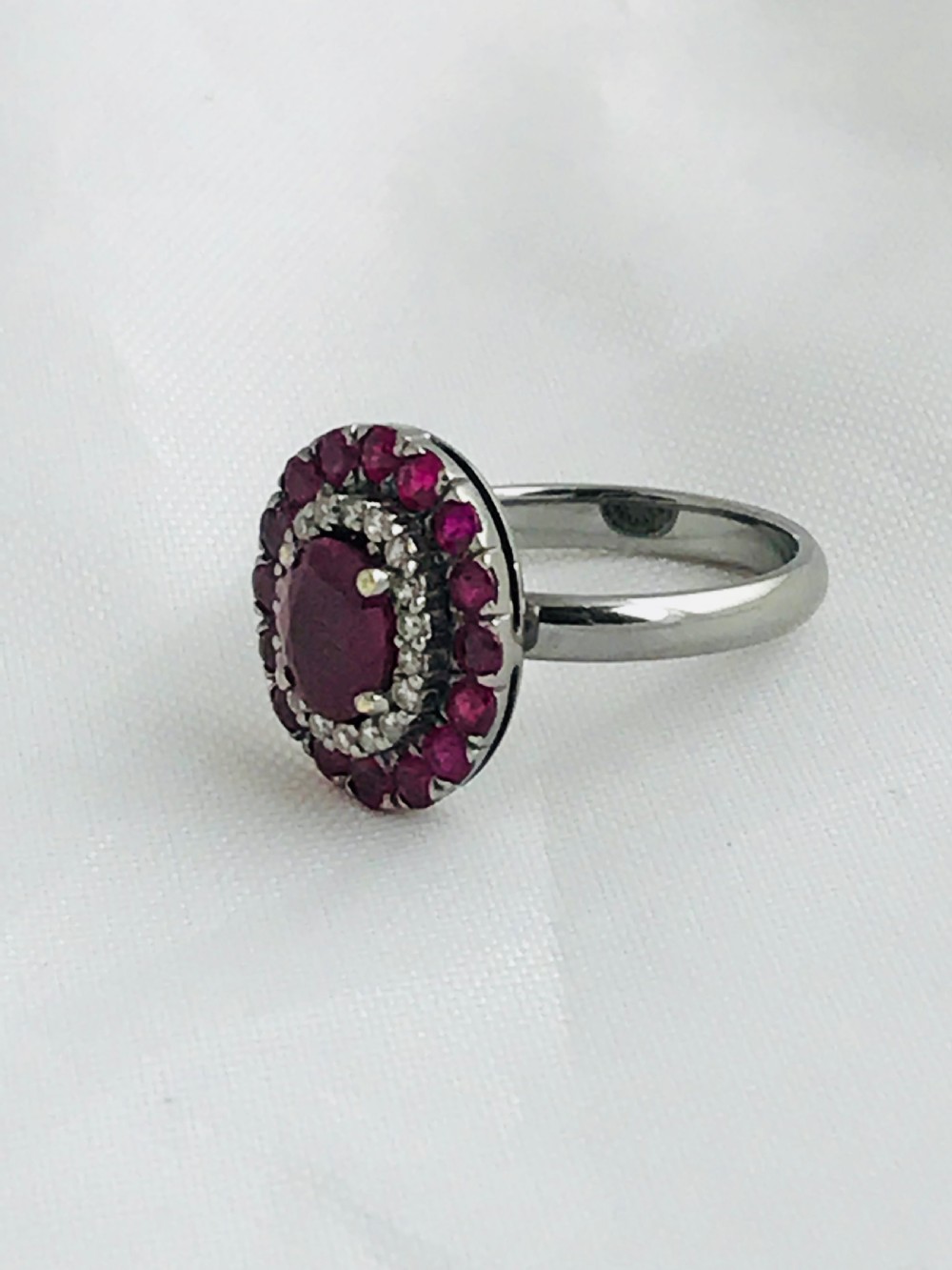 A beautiful Art Deco 18ct white gold ruby and diamond cluster ring View X