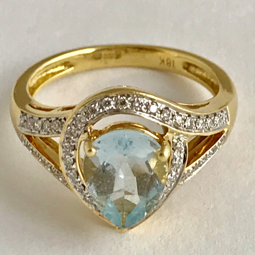 An Art Deco 3ct Aquamarine with 0.5ct of Diamonds ring set in 18ct yellow gold