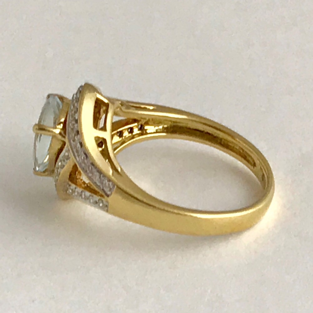 An Art Deco 3ct Aquamarine with 0.5ct of Diamonds ring set in 18ct yellow gold View V