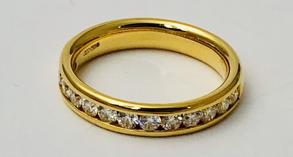 Beautiful 18 carat gold channel set diamond half eternity ring
