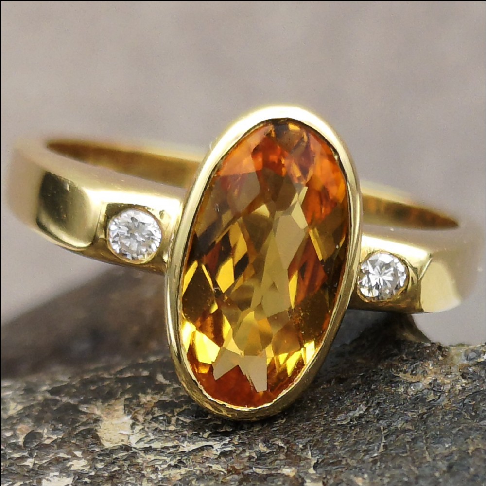 Stunning 18 carat gold citrine and diamond three stone ring