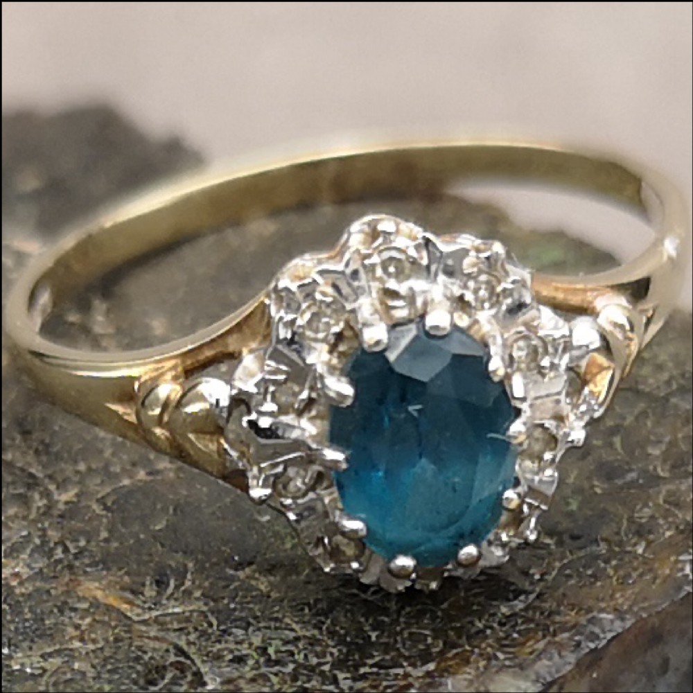 Lovely 9CT gold topaz and diamond cluster ring 
