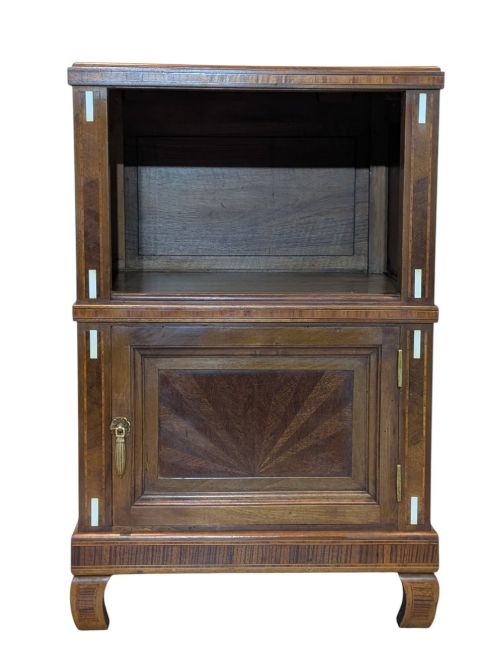 fig 1. An antique dark wood bedside cabinet featuring an open upper compartment, a lower single door cupboard with marquetry detail, white line inlays, and short curved legs.