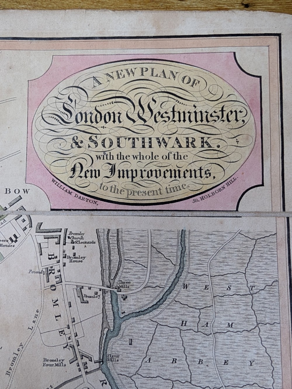 An antique printed paper pocket map of London in a dark slipcase titled The Strangers Guide Through the Streets of London by Saml. Ward. View IX