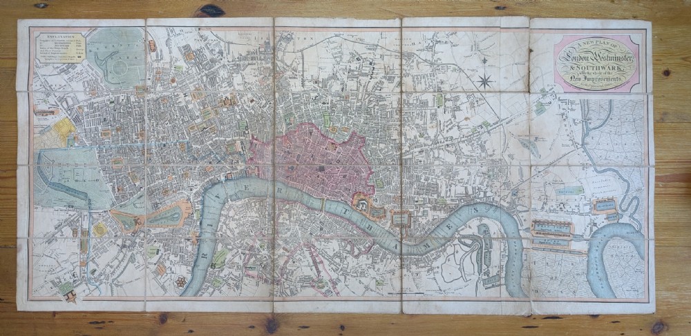 An antique printed paper pocket map of London in a dark slipcase titled The Strangers Guide Through the Streets of London by Saml. Ward. View X