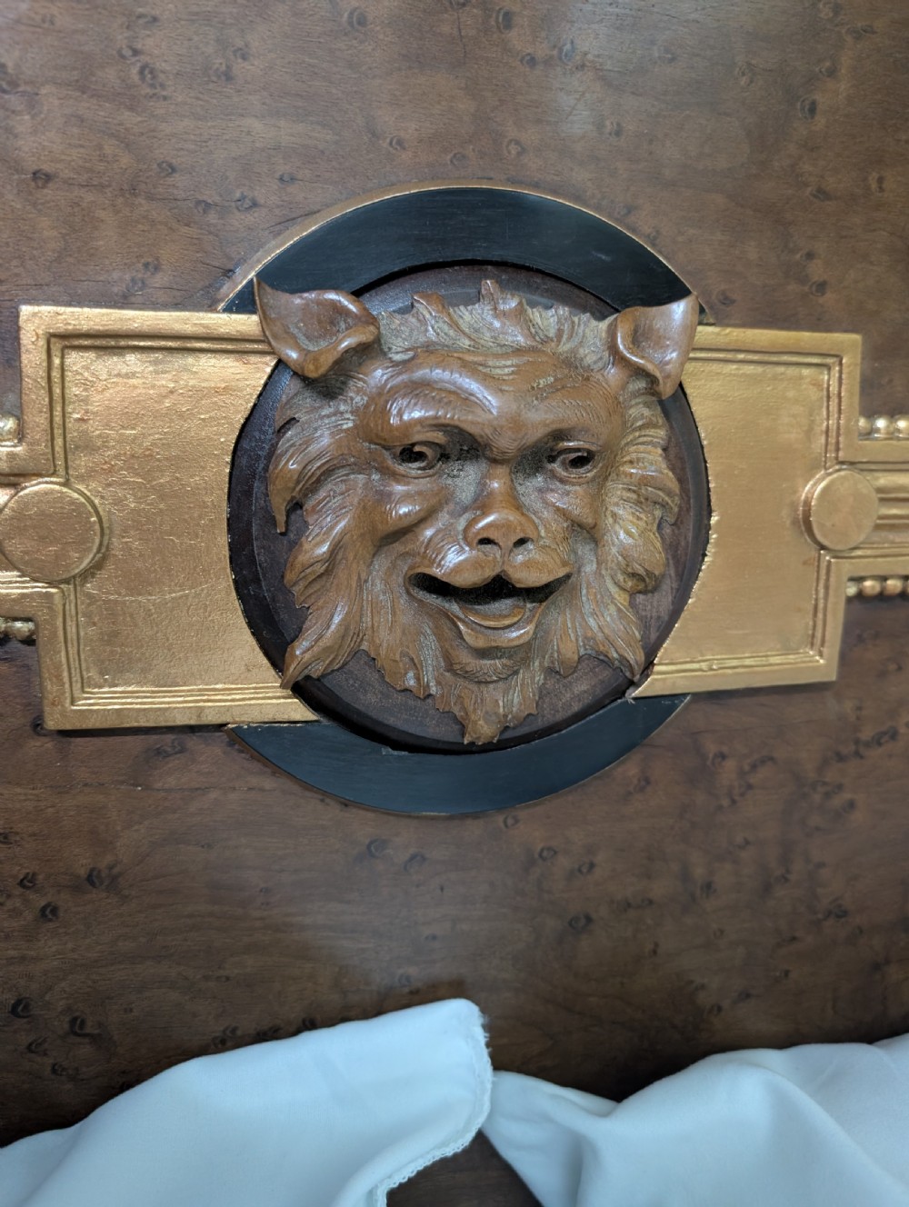 An Empire style king-sized bedstead crafted in golden veneered wood with gilt mounts and a Greek key border along the footboard base. View VIII