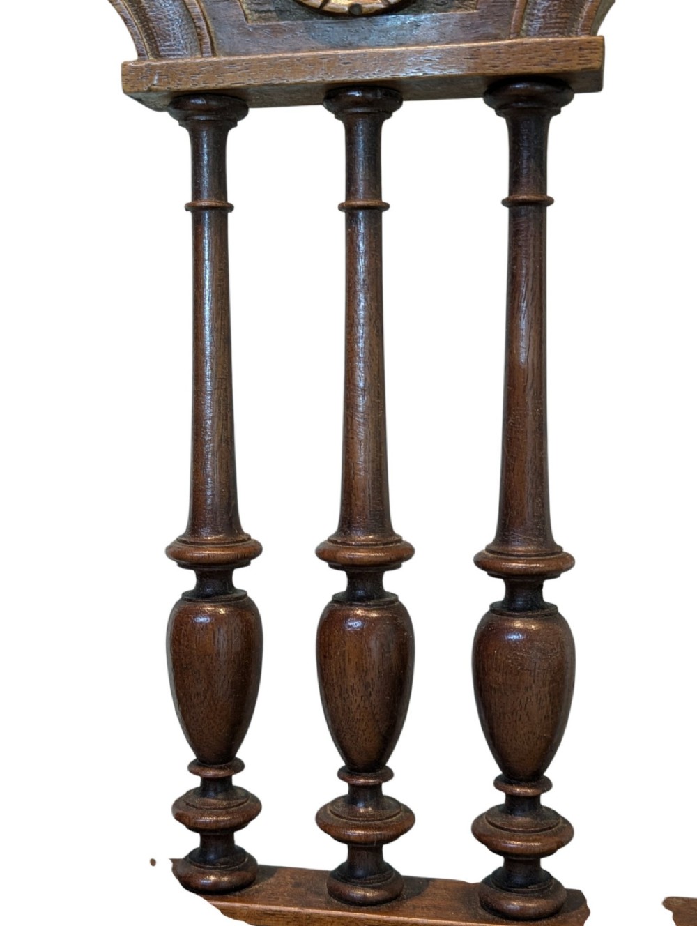 A set of four antique dark carved oak dining chairs featuring openwork spindle backs and woven cane seats. View VIII