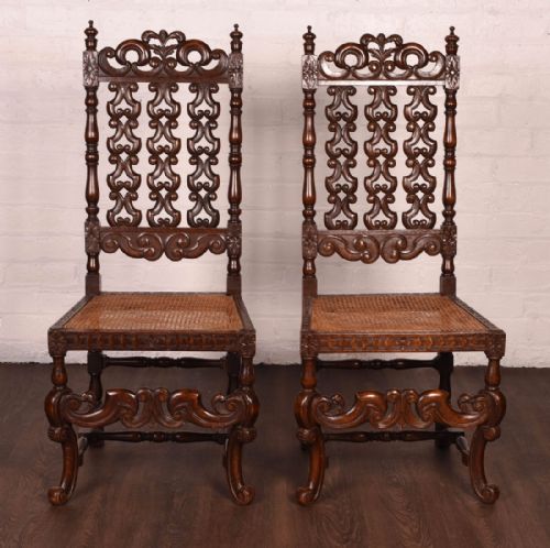 An Elaborate Pair of Carved Hall Chairs