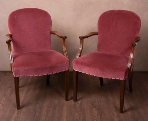 An Elegant Pair of Upholstered Elbow Desk Chairs