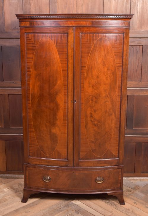 A Neat Proportioned Edwardian Mahogany Bow Fronted Wardrobe