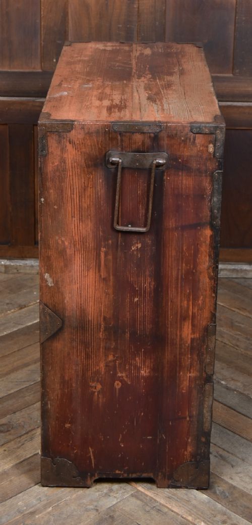 A Japanese tansu wooden chest featuring multiple drawers, sliding louvered doors, a small lockable door, and dark iron corner plates and drop handles. View IX