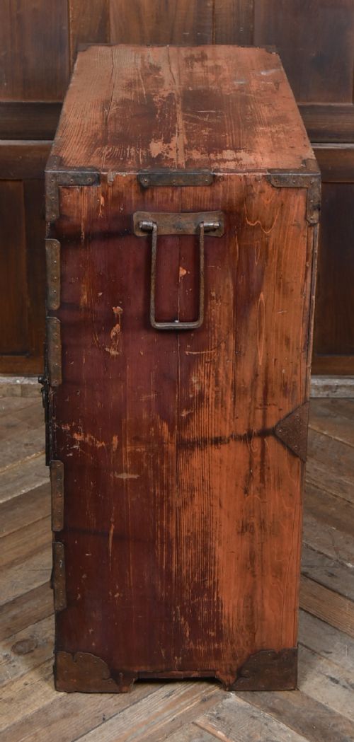 A Japanese tansu wooden chest featuring multiple drawers, sliding louvered doors, a small lockable door, and dark iron corner plates and drop handles. View XII