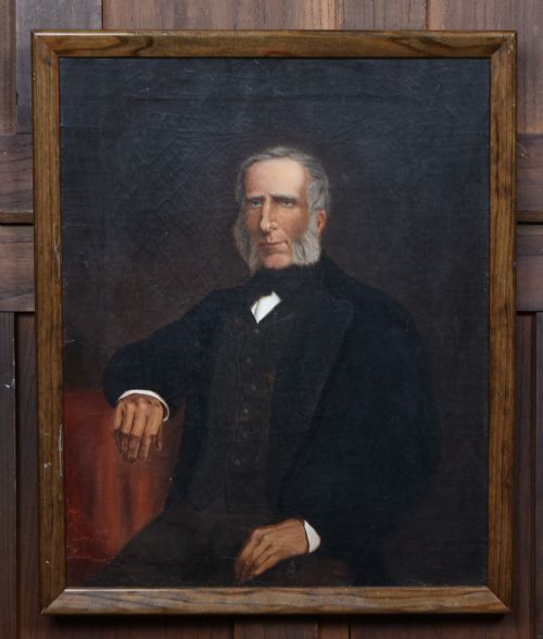 fig 1. A nineteenth-century oil painting depicting a seated gentleman with sideburns wearing a black coat, framed in a simple dark wooden border.