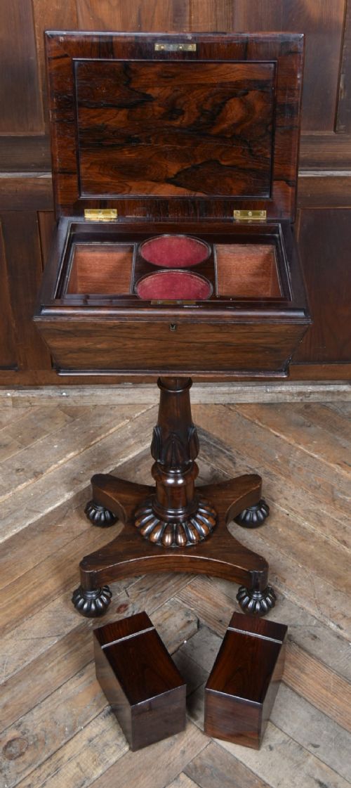 A Victorian dark rosewood teapoy featuring a sarcophagus-shaped chest top resting on a turned carved pedestal and quadruped base. View VIII