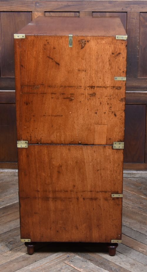 A 19th-century mahogany campaign chest of drawers with two short over three long drawers, featuring inset brass handles and brass corner straps. View X