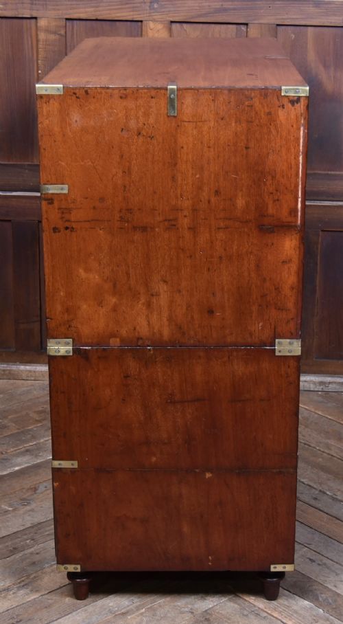 A 19th-century mahogany campaign chest of drawers with two short over three long drawers, featuring inset brass handles and brass corner straps. View XII