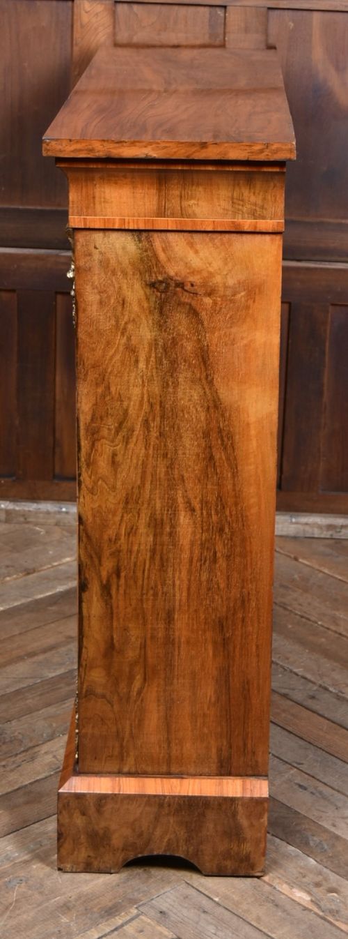A Victorian walnut pier cabinet featuring double glazed arched doors, floral marquetry inlay, and decorative ormolu mounts. View XII