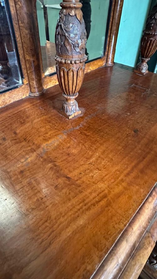 A large Victorian pollard oak mirror-back sideboard featuring carved urn finials, central mirror glass, open side shelving, and ebonised drawer borders. View VIII