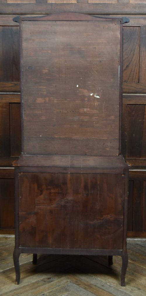 A French walnut vitrine cabinet featuring curved glass upper panels, gilt-bronze ormolu mounts, cabriole legs, and a hand-painted lower door panel depicting a figurative scene. View XIII